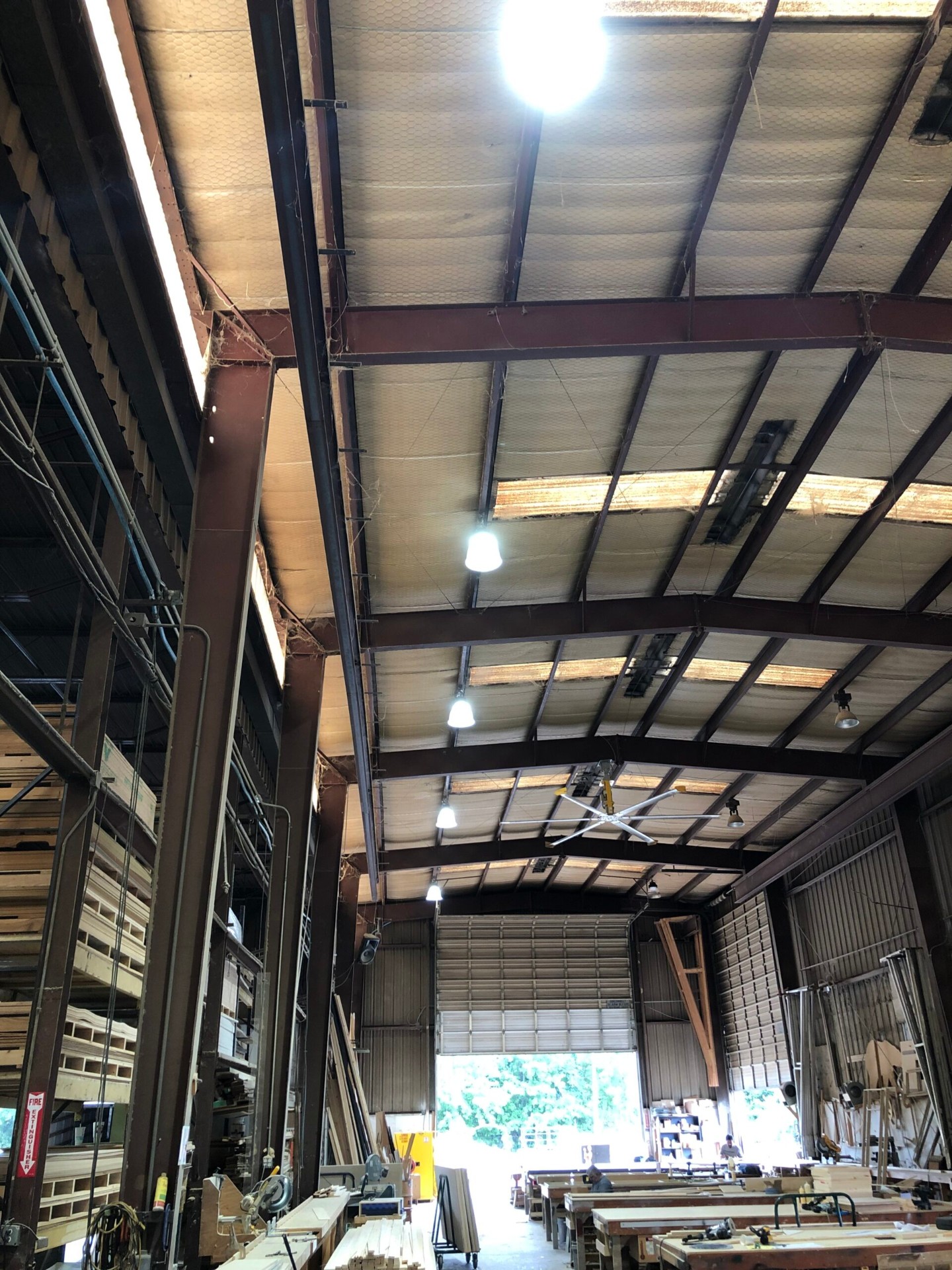 Industrial warehouse electrical installation with overhead lighting and power distribution