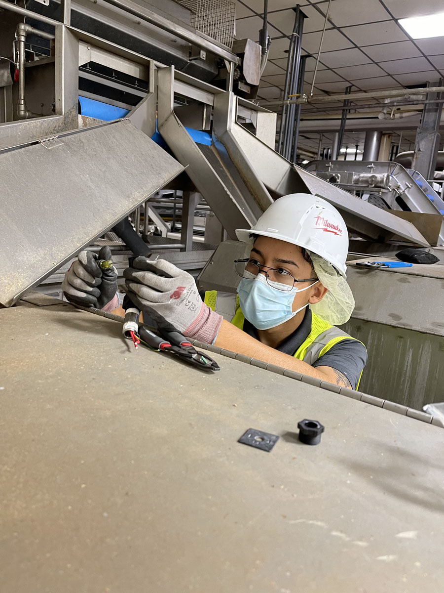 Professional electrician working on industrial electrical equipment